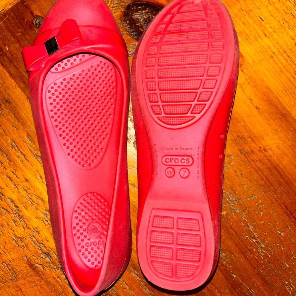Crocs. Red ballet flats with silver embellishment. Never worn sz 7